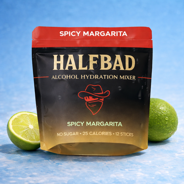 HALFBAD Spicy Margarita alcohol hydration mixer package with limes on a blue background