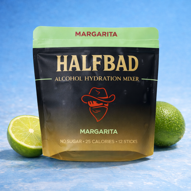 HALFBAD Margarita alcohol hydration mixer package with limes on a blue background